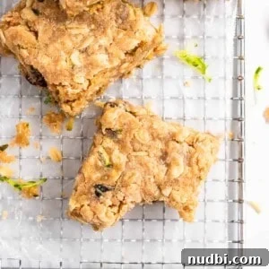 Zucchini Oat Bars Recipe: Moist Baked Snack Bars with Oats 7 Zucchini bars on cooling rack.