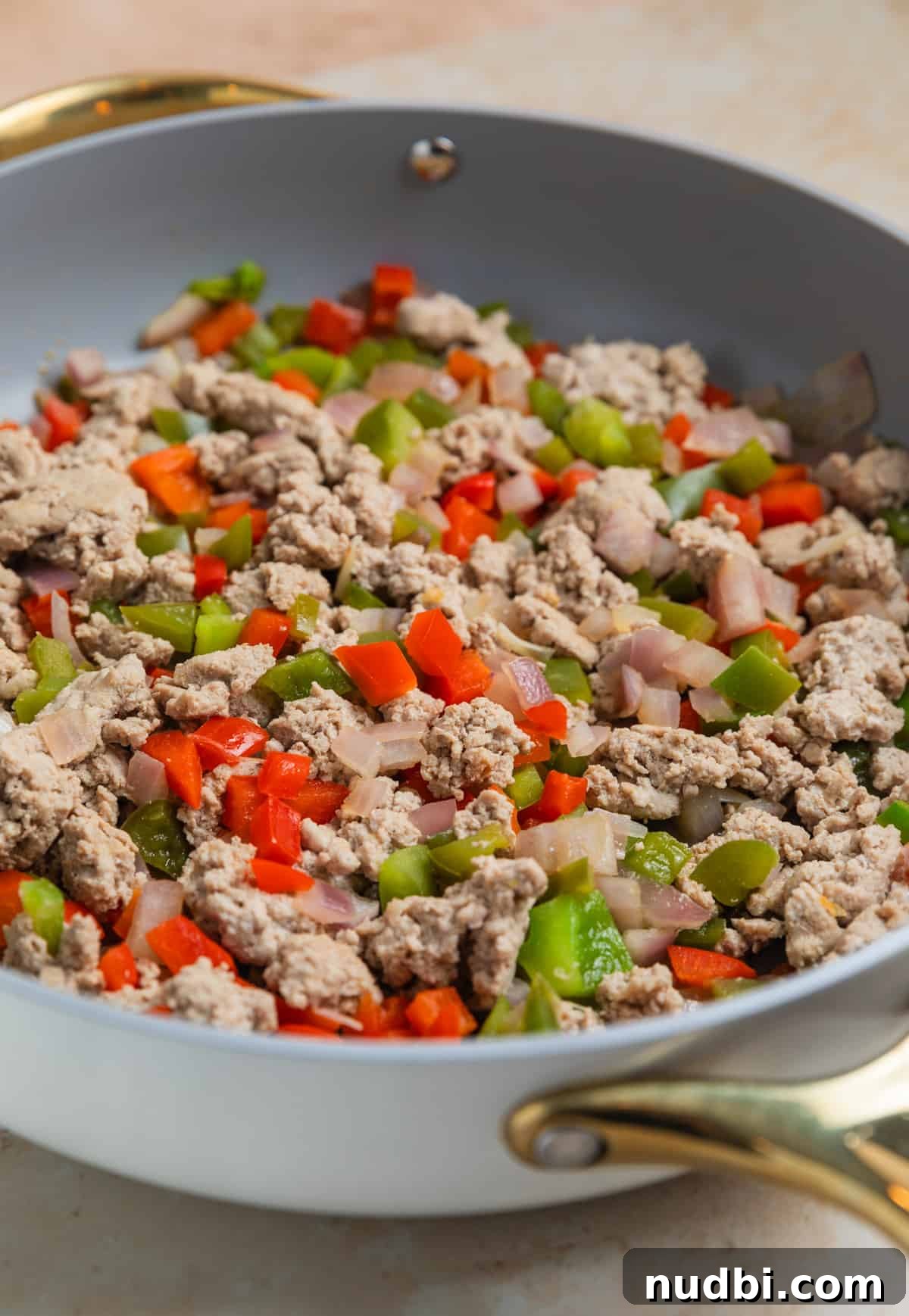 One-Pan Ground Turkey and Sweet Potato Skillet Recipe 5 Browned ground turkey and bell peppers in large skillet.