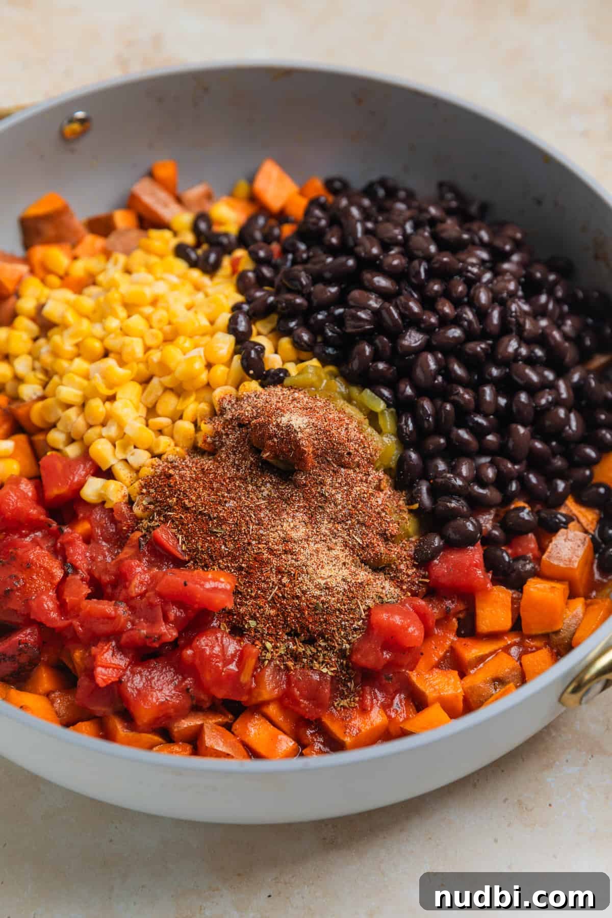 One-Pan Ground Turkey and Sweet Potato Skillet Recipe 7 Black beans, corn, tomatoes and seasoning added to skillet with cooked sweet potatoes.