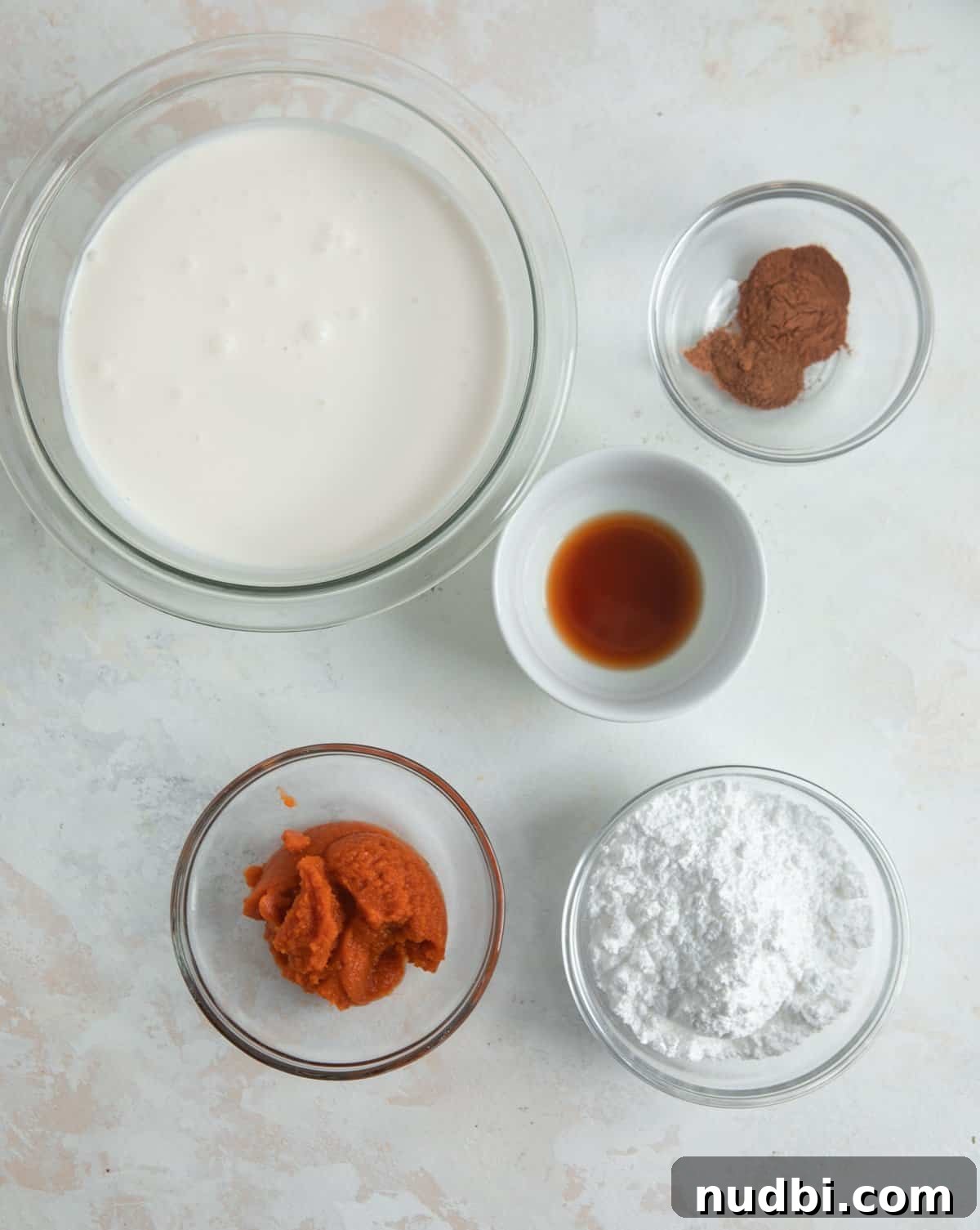 Pumpkin Spice Whipped Cream Recipe — Light & Fluffy Topping 4 Heavy whipping cream, powdered sugar, pumpkin and other ingredients prepped to make recipe.