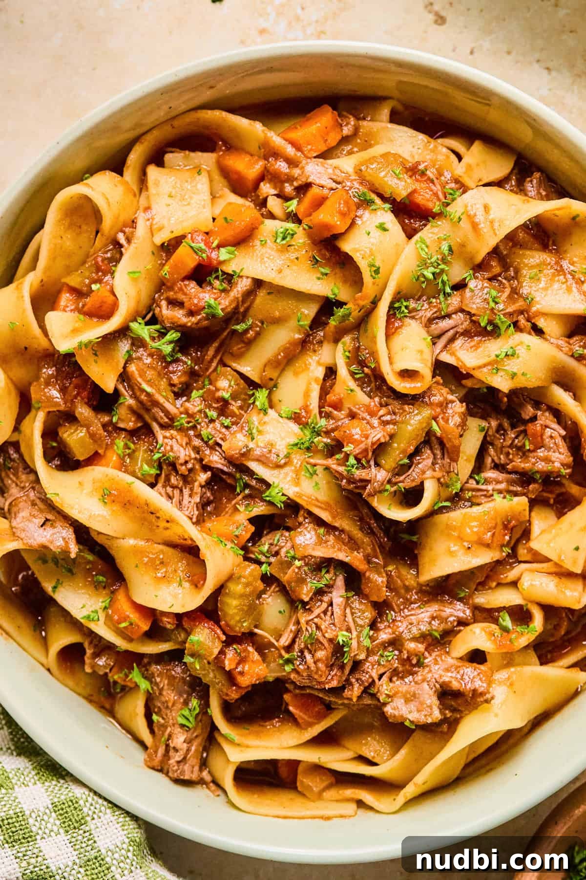 Slow-Cooked Short Rib Ragu Recipe for Tender Pasta Nights 12 Short rib ragu tossed with pappardelle pasta and topped with chopped parsley