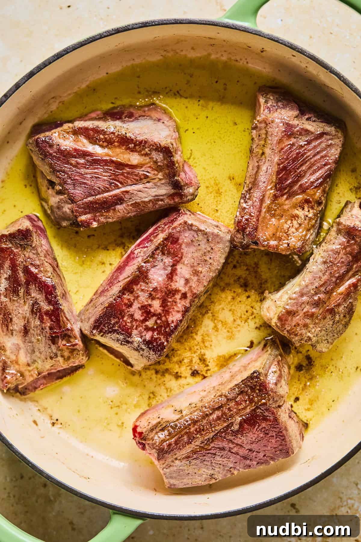 Slow-Cooked Short Rib Ragu Recipe for Tender Pasta Nights 5 Seared short ribs in dutch oven.