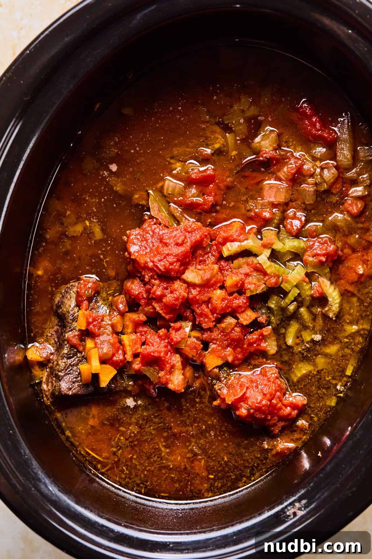 Slow-Cooked Short Rib Ragu Recipe for Tender Pasta Nights 8 Cooked short rib ragu in crockpot before meat is pulled.