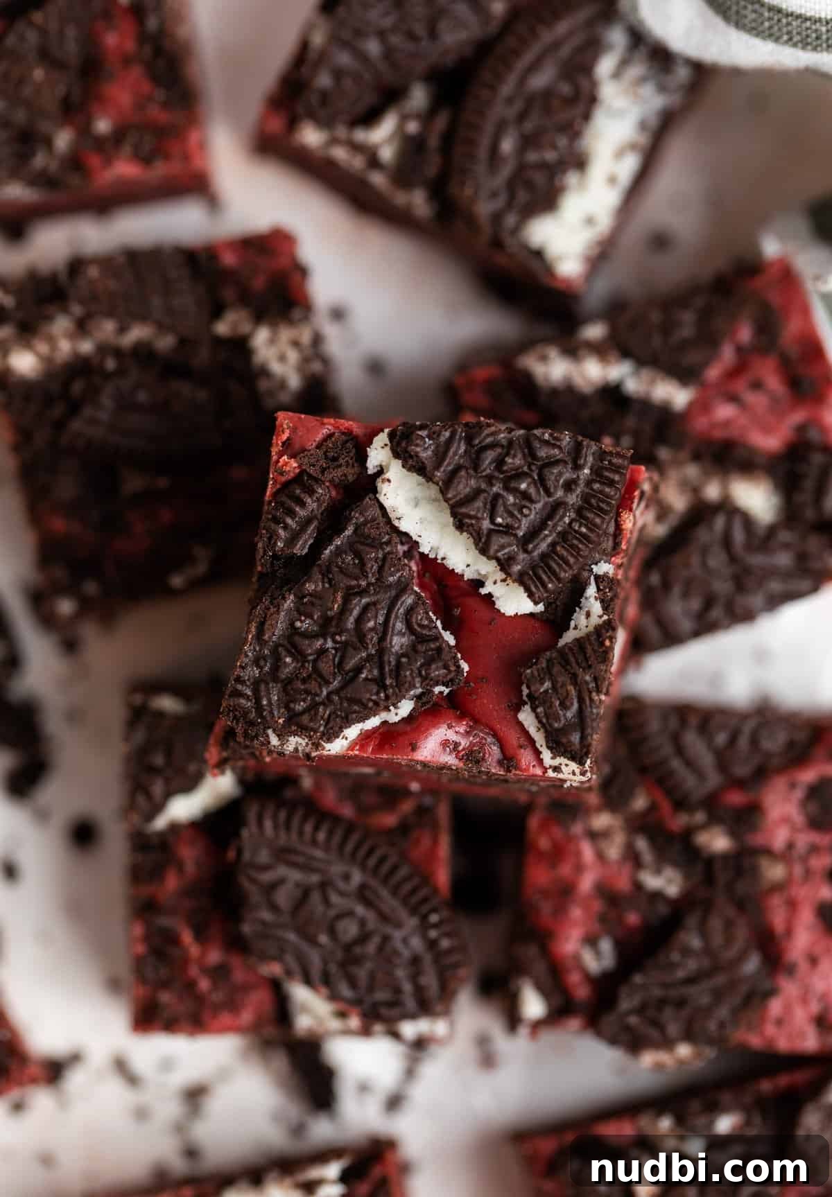 Decadent Red Velvet Oreo Fudge Recipe for Chocolate Lovers 3 No bake red velvet fudge with Oreos crushed on top.