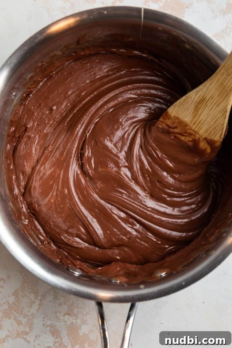 Decadent Red Velvet Oreo Fudge Recipe for Chocolate Lovers 5 Fudge melted in saucepan.