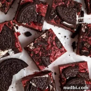 Decadent Red Velvet Oreo Fudge Recipe for Chocolate Lovers 10 Overhead view of red velvet Oreo fudge with Oreos surrounding.