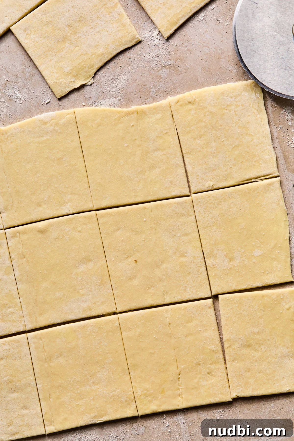 Flaky Puff Pastry Quiche Recipe: Quick Savory Tart for Brunch 7 Puff pastry rolled out and cut into squares.