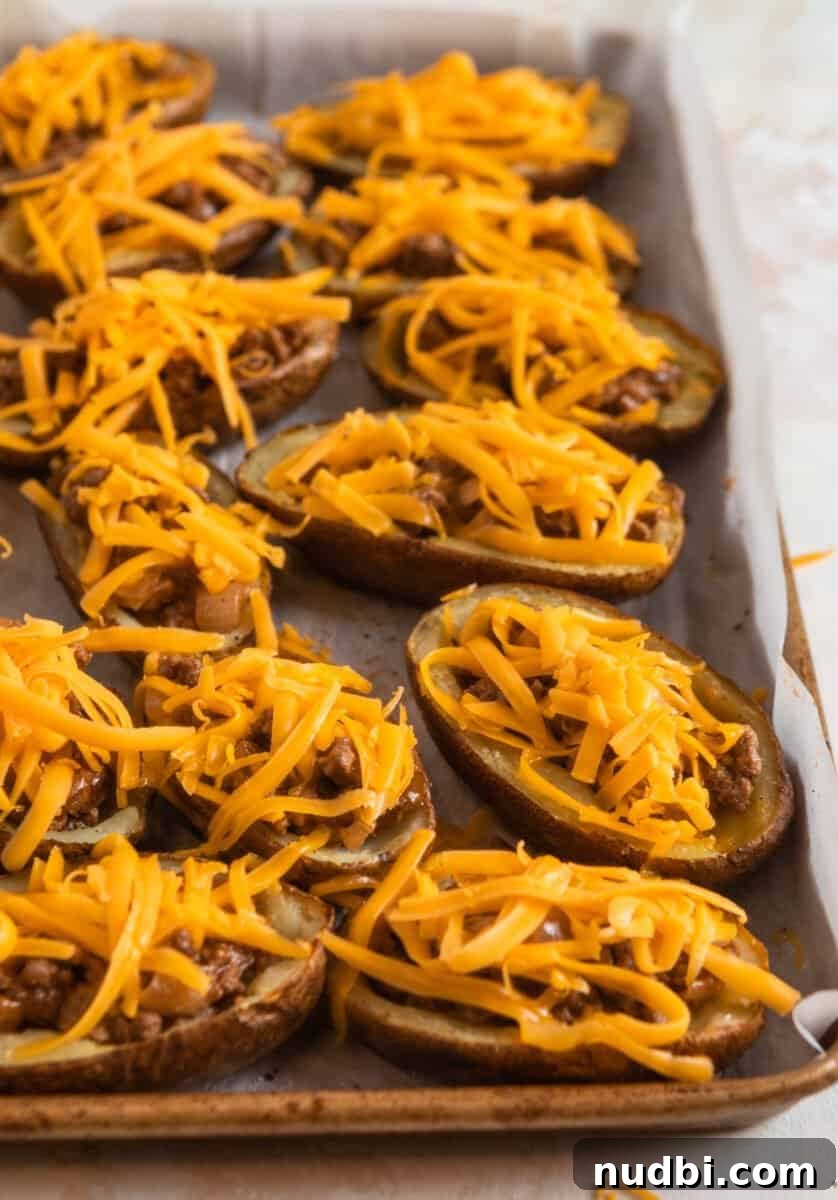 Cheeseburger-Stuffed Potato Skins: Loaded Appetizer Recipe 10 Cheese topped cheeseburger potato skins.
