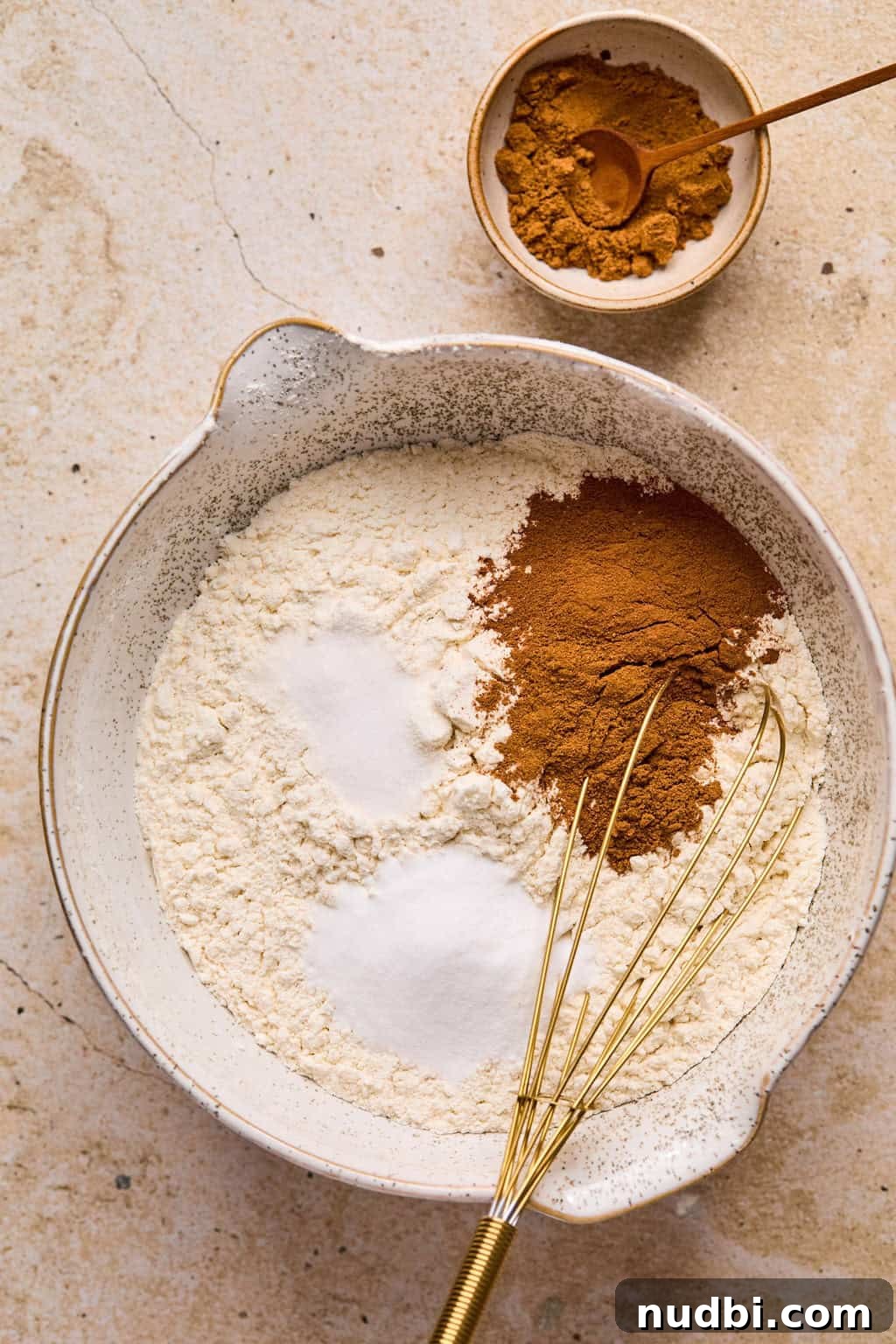 Pumpkin Spice Molasses Cookies Recipe with Warm Autumn Flavor 6 Dry ingredients for cookies in mixing bowl with whisk.
