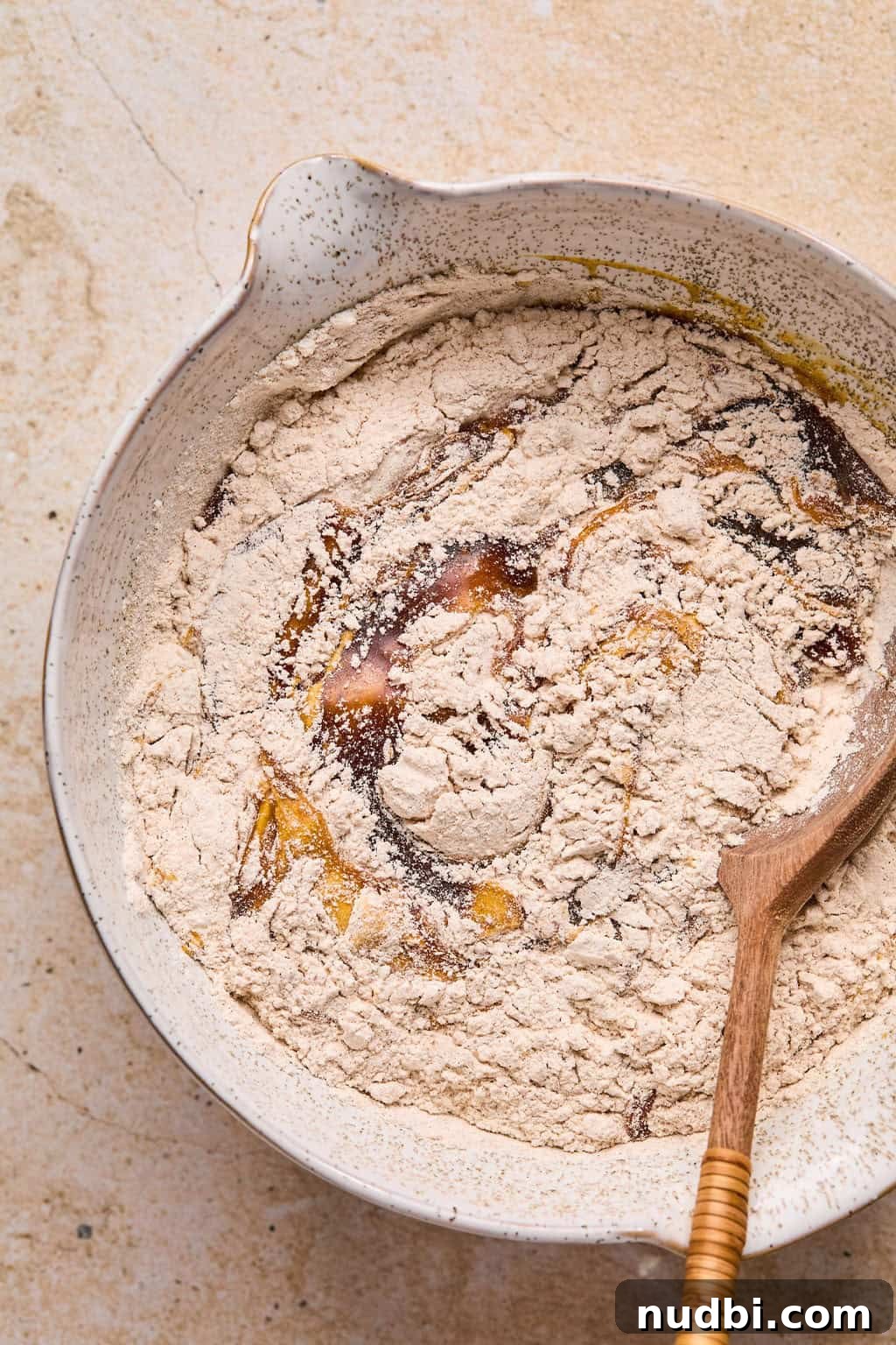 Pumpkin Spice Molasses Cookies Recipe with Warm Autumn Flavor 7 Dry and wet ingredients for pumpkin molasses cookies being combined in bowl.