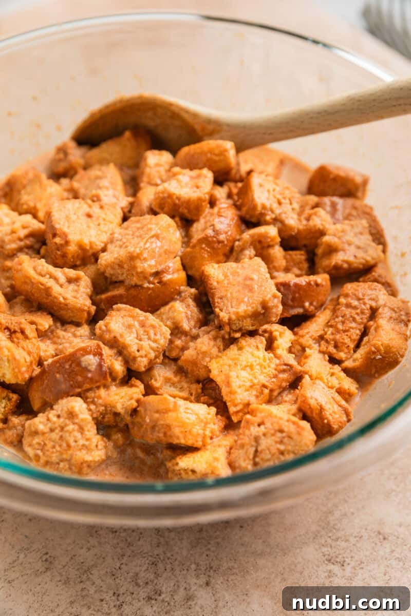 Pumpkin Spice French Toast Casserole Recipe for Fall Brunch 5 Brioche bread cubed and combined with pumpkin French toast egg mixture.