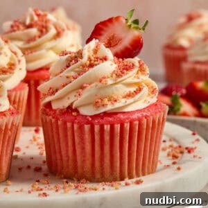 Strawberry Crunch Cupcakes with Crunchy Topping and Cream Cheese Frosting 14 Strawberry cupcakes with buttercream topped strawberry crunch topping.