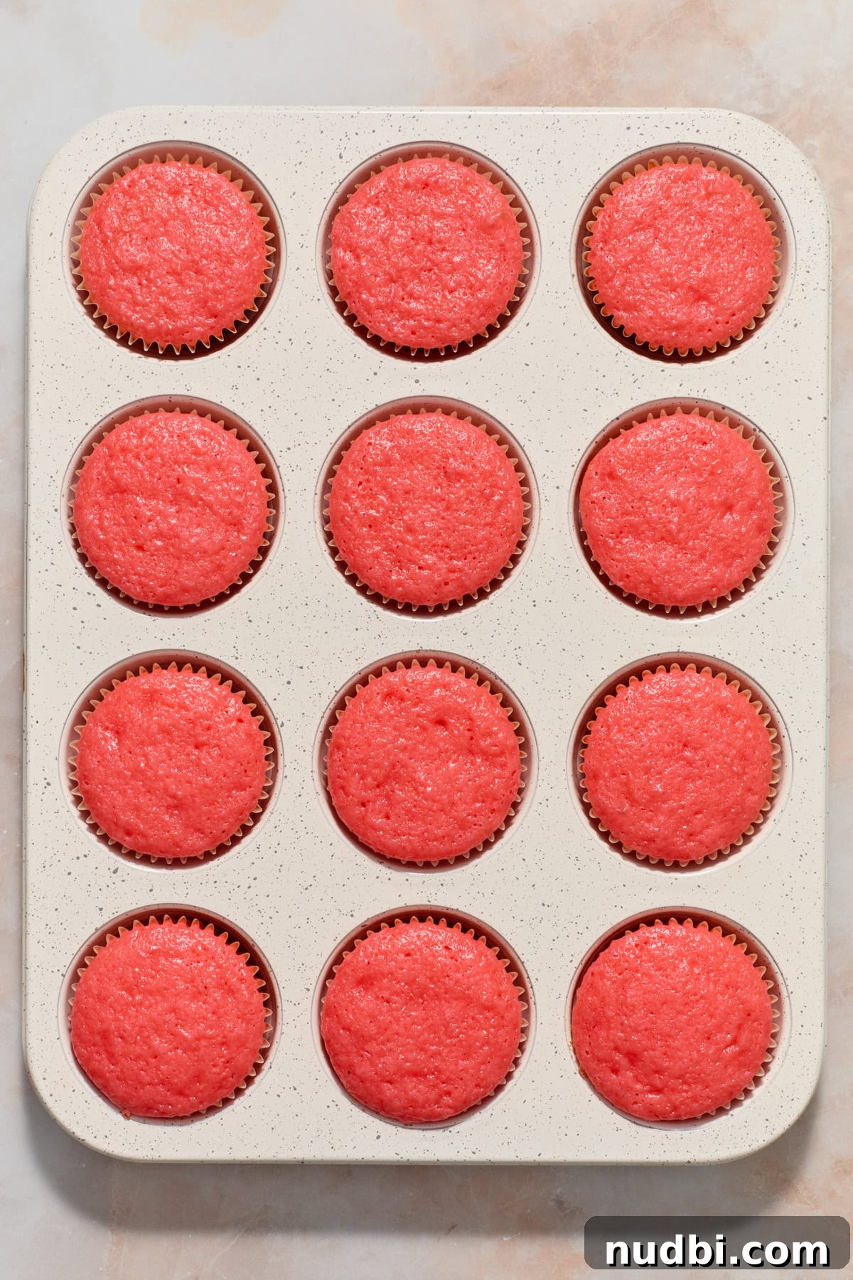 Strawberry Crunch Cupcakes with Crunchy Topping and Cream Cheese Frosting 7 Baked strawberry cupcakes in muffin tin.