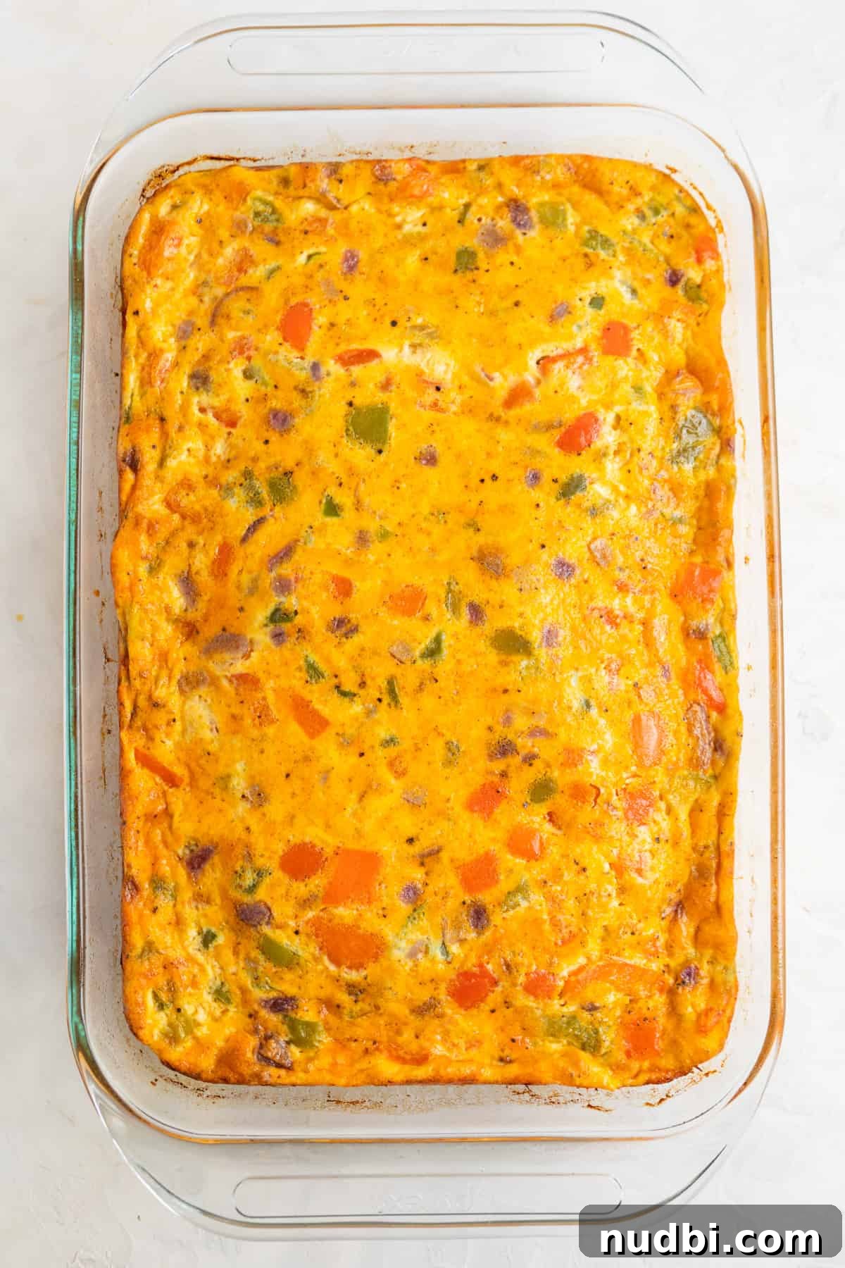 Cheesy Chorizo and Egg Breakfast Casserole 8 Chorizo breakfast casserole in glass pan freshly baked.