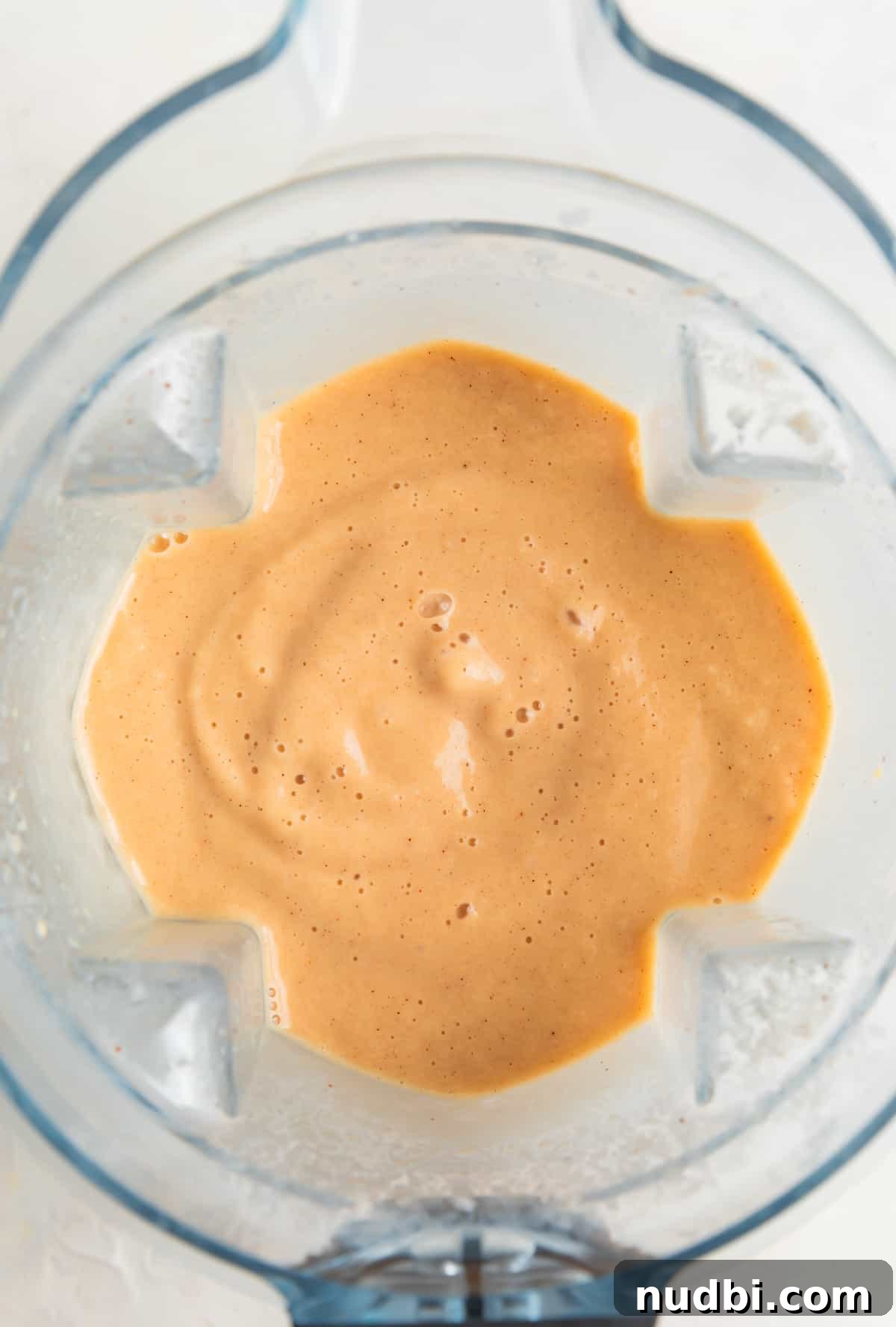 Creamy Banana and Peach Smoothie Recipe for Summer Refreshment 4 Banana peach smoothie blended in the blender.