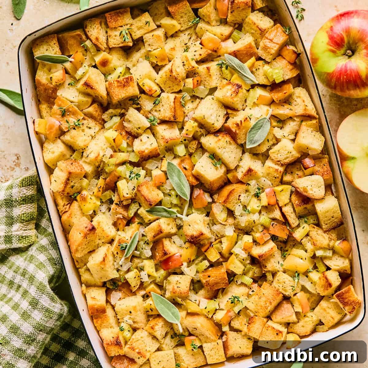 Pan with apple stuffing topped with herbs.