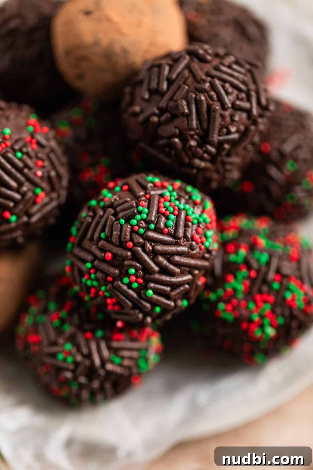 Amaretto Truffles Recipe with 5 Ingredients — Simple Chocolate Bonbons 2 Overhead view of amaretto truffles coated in sprinkles on dish.