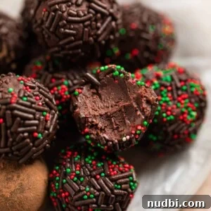 Amaretto Truffles Recipe with 5 Ingredients — Simple Chocolate Bonbons 12 5 ingredient amaretto truffles on wax paper lined dish.
