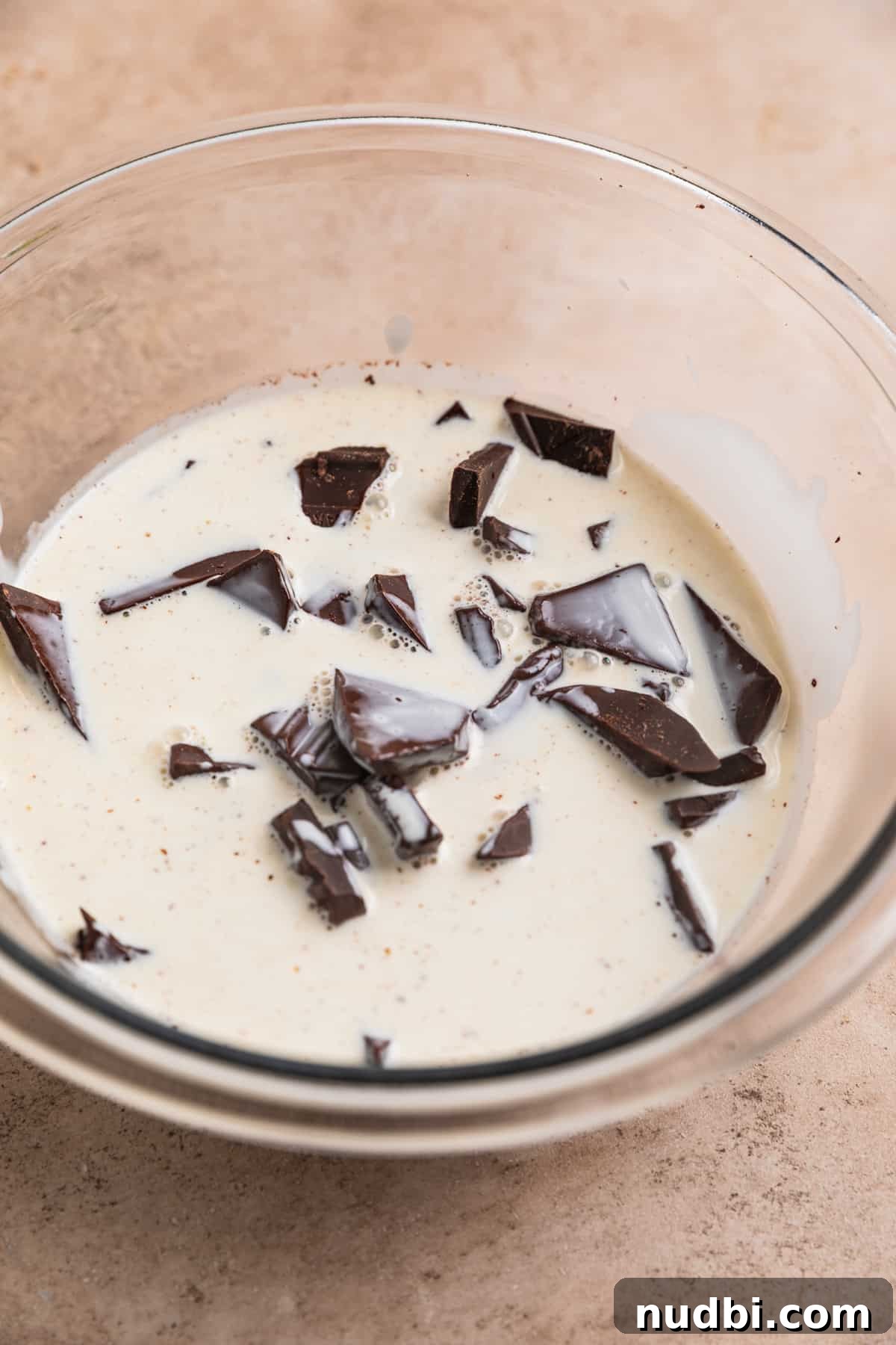 Amaretto Truffles Recipe with 5 Ingredients — Simple Chocolate Bonbons 5 Warm cream poured over dark chocolate in mixing bowl