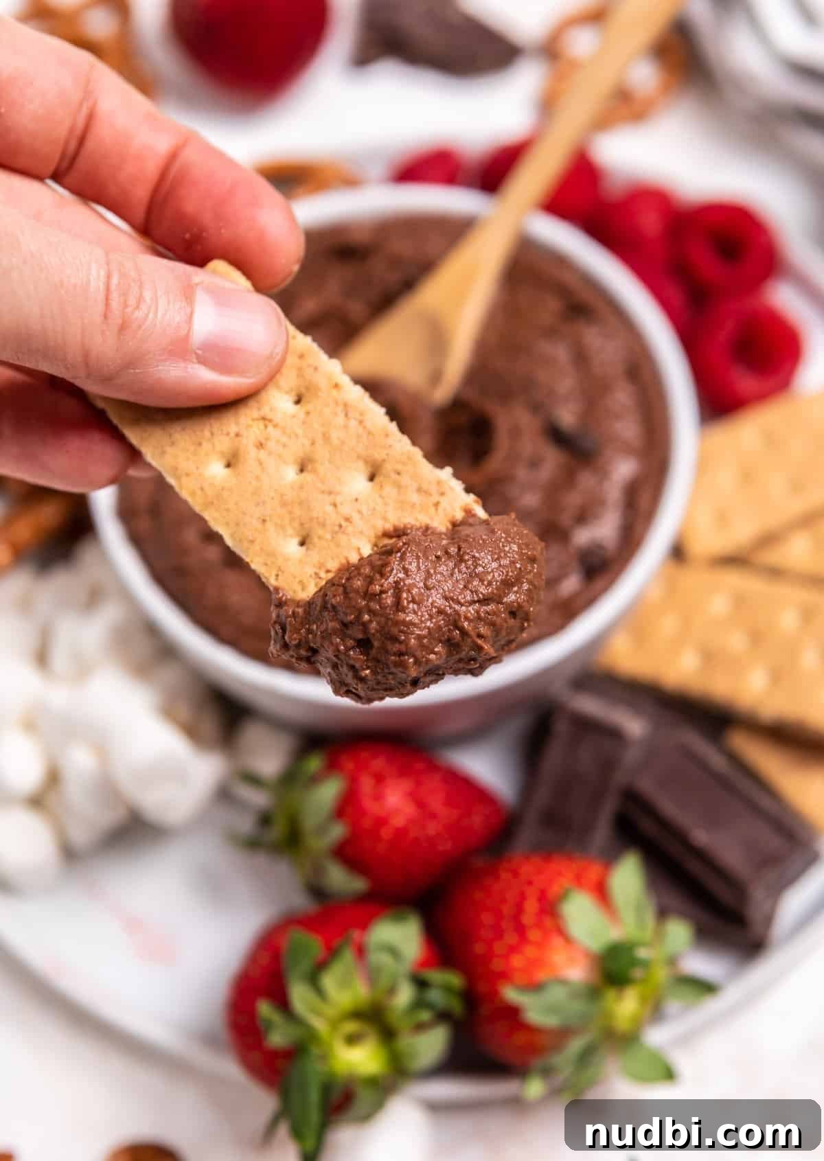 Decadent Brownie Batter Hummus Recipe: Dessert Dip Made Vegan 3 Graham cracker with chocolate hummus on it.