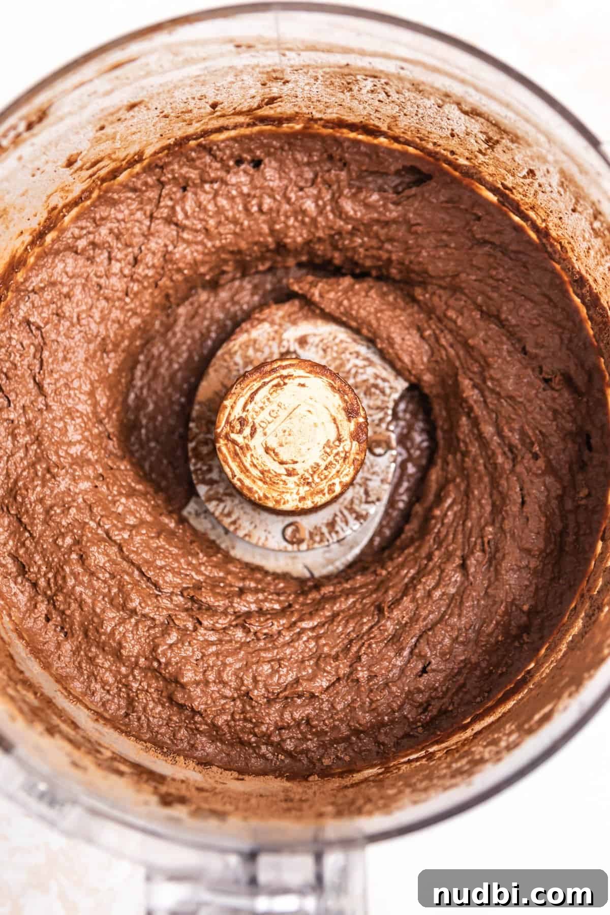 Decadent Brownie Batter Hummus Recipe: Dessert Dip Made Vegan 5 Brownie batter hummus in food processor.