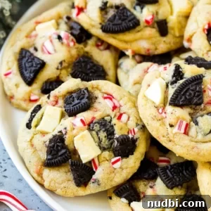 White plate with peppermint Oreo and white chocolate cookies.