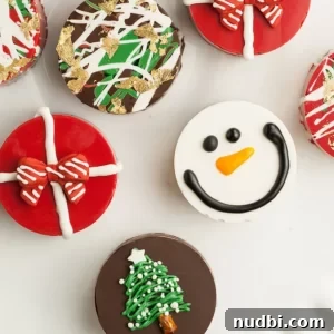 Oreos dipped in chocolate and decorated in Christmas theme.