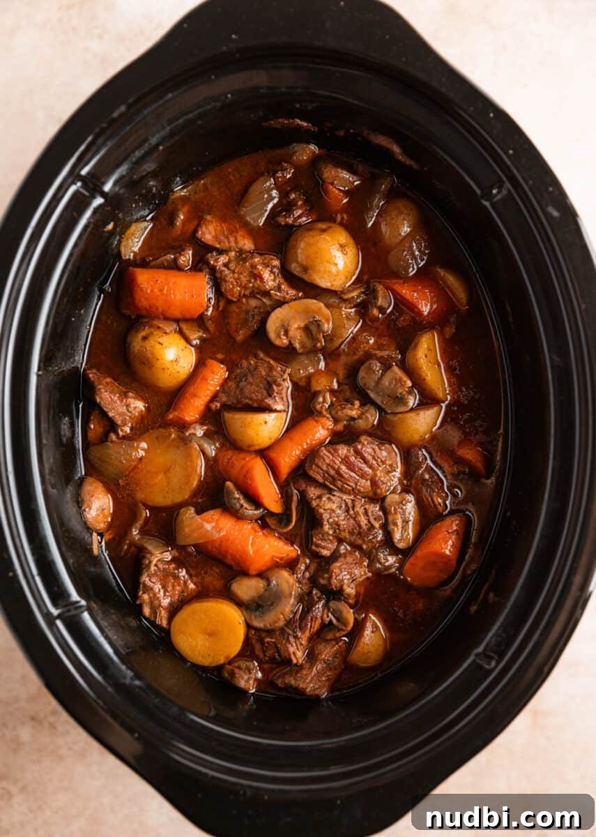 Slow Cooker Beef and Mushroom Stew Recipe for Tender Comfort Food 11 Crock pot beef stew with mushrooms cooked before adding corn starch slurry.