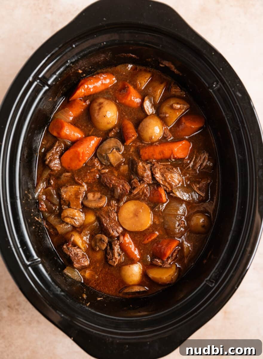 Slow Cooker Beef and Mushroom Stew Recipe for Tender Comfort Food 12 Beef stew after adding slurry to thicken.