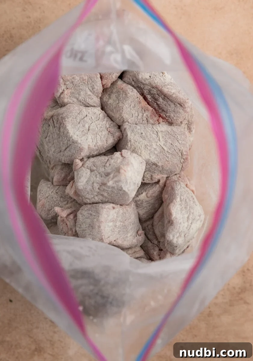 Slow Cooker Beef and Mushroom Stew Recipe for Tender Comfort Food 6 Flour coated beef in plastic bag.