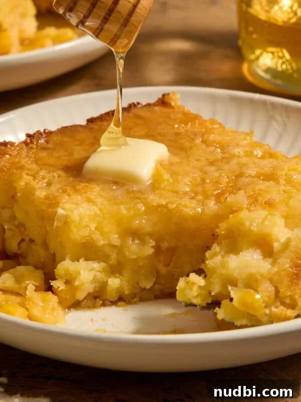 Juicy Slow Cooker Turkey Breast Recipe 15 Sweet jiffy cornbread casserole on plate with honey drizzling over top.