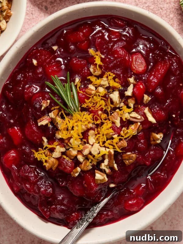 Juicy Slow Cooker Turkey Breast Recipe 16 Bowl of apple cranberry chutney with orange zest, pecans and rosemary on top.