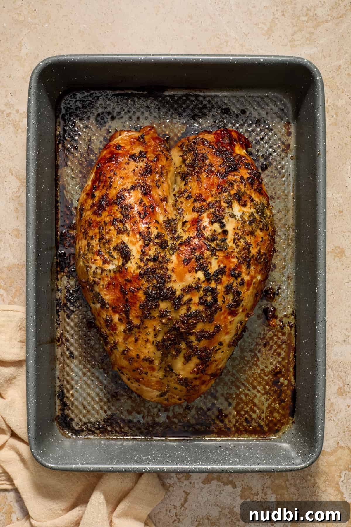 Juicy Slow Cooker Turkey Breast Recipe 10 Broiled turkey in baking pan.