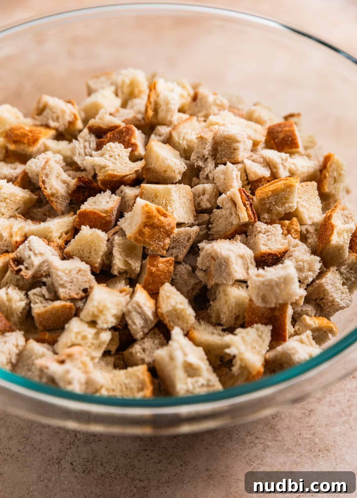 Turkey Sausage Stuffing Recipe for Thanksgiving and Holiday Meals 6 Stale bread cubed in mixing bowl.