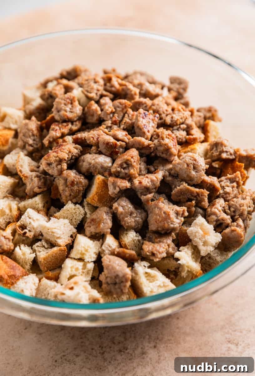 Turkey Sausage Stuffing Recipe for Thanksgiving and Holiday Meals 8 Turkey sausage and bread added to mixing bowl.