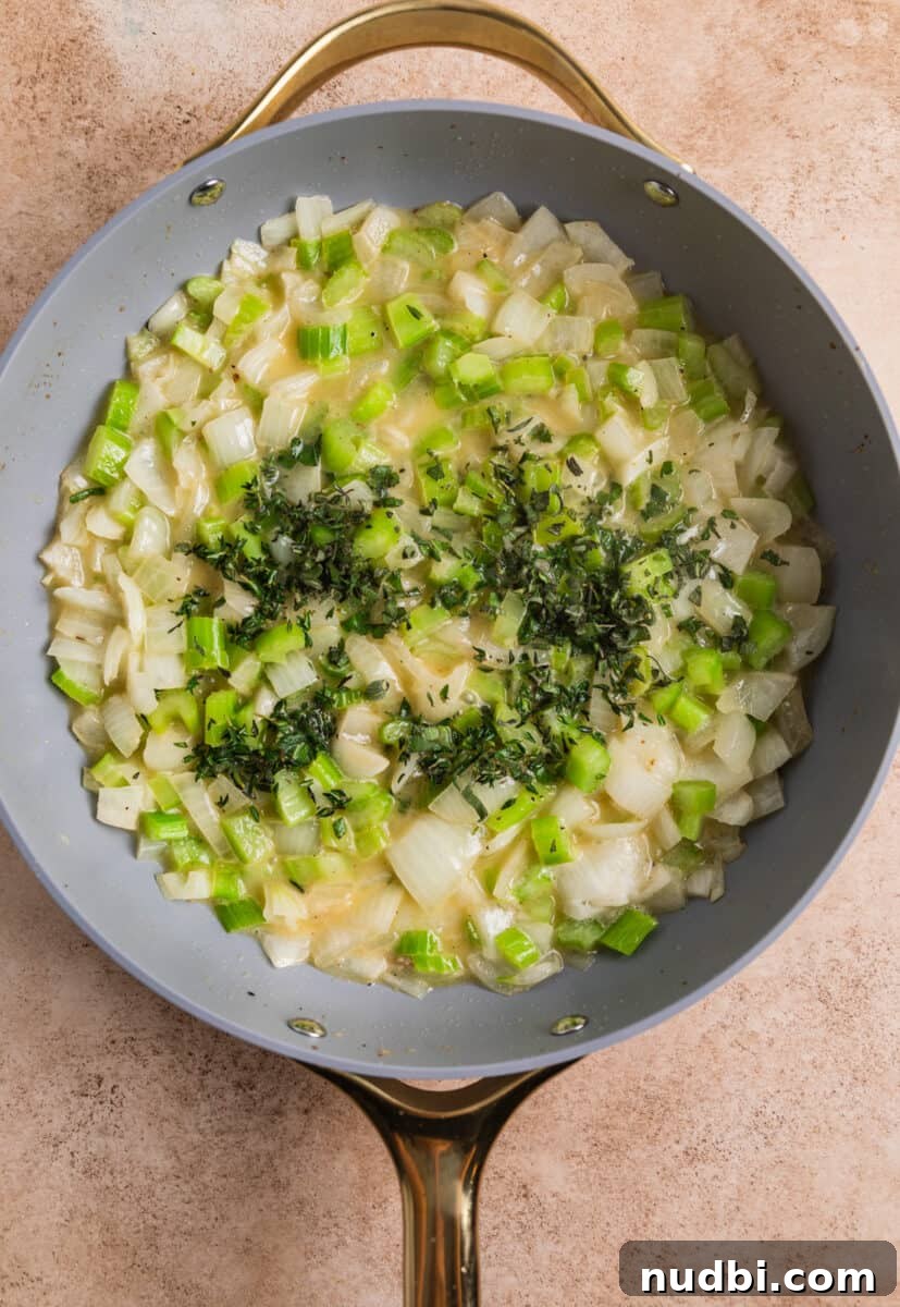 Turkey Sausage Stuffing Recipe for Thanksgiving and Holiday Meals 9 Sautéed onions an d celery in skillet with butter, topped with fresh herbs.