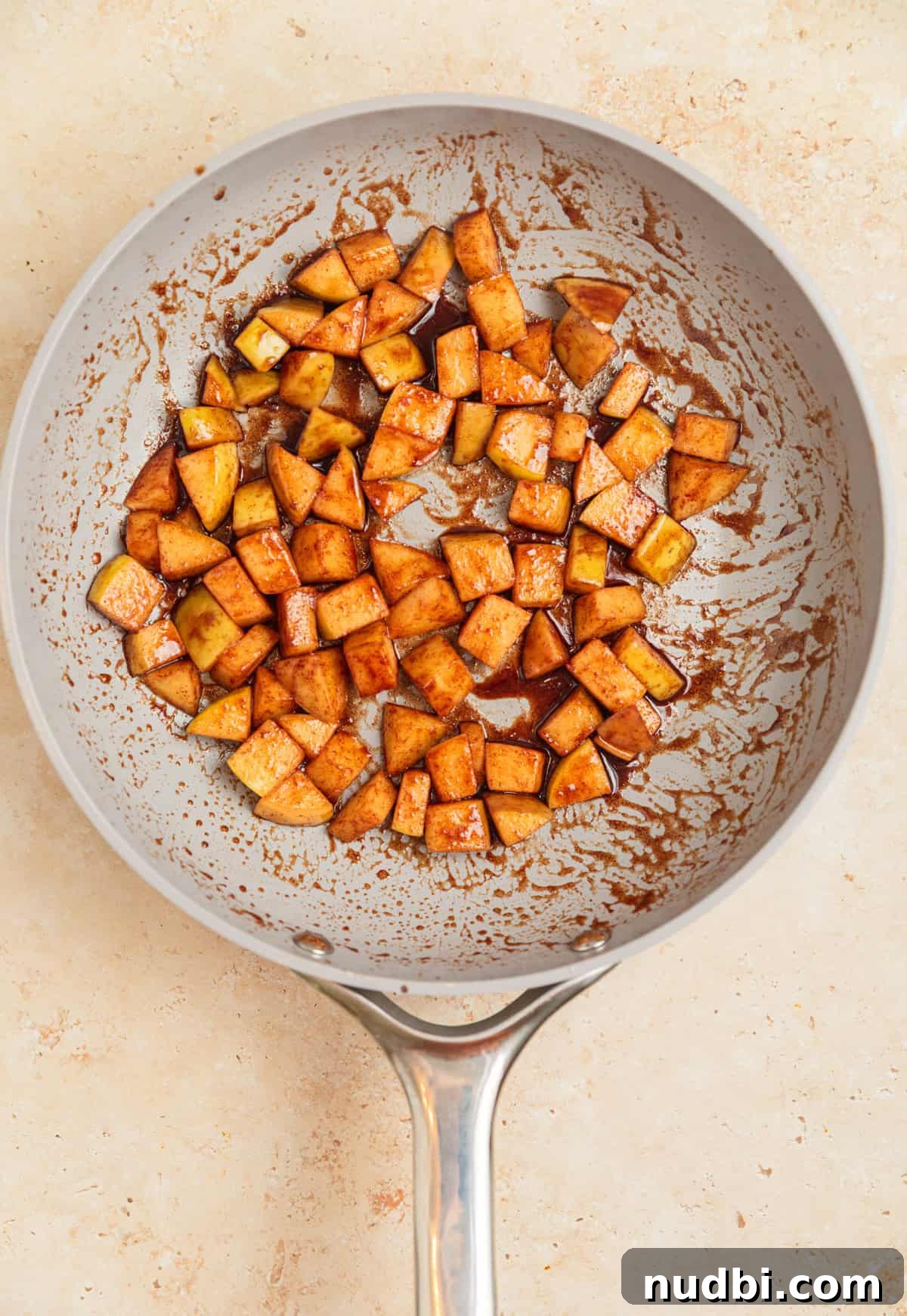 Apple Cinnamon Overnight Oats Recipe for Quick Breakfast 6 Cinnamon apples in skillet.