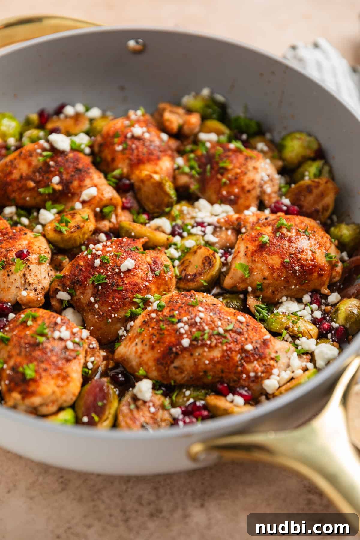 Sheet Pan Chicken Thighs with Roasted Brussels Sprouts 3 Gray pan with dijon balsamic chicken thighs and brussel sprouts.