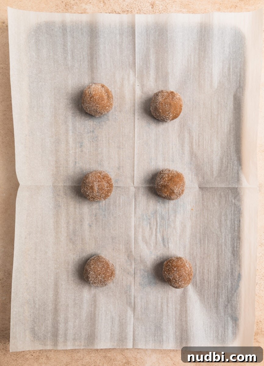 Chewy Ginger Cream Cookie Recipe for Perfect Holiday Baking 9 Parchment lined baking sheet with cookies before baking.