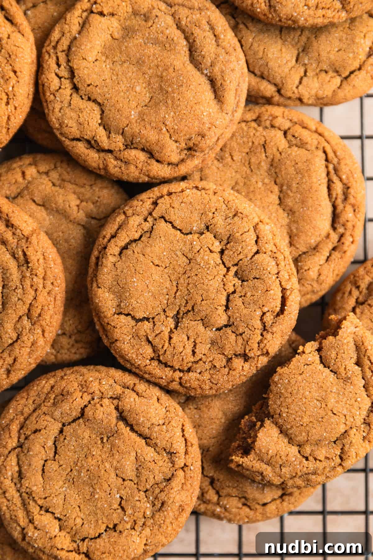 Chewy Ginger Cream Cookie Recipe for Perfect Holiday Baking 4 Ginger cookies on wire cooling rack.