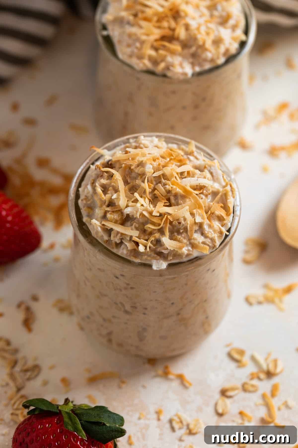 Coconut Cream Pie Overnight Oats Recipe for Creamy Breakfast 4 Jar of overnight oatmeal with coconut shredded over top.
