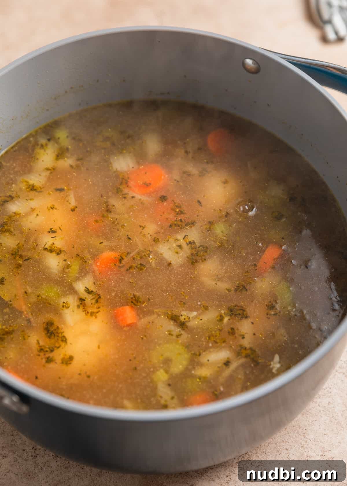 Lemony Chicken Orzo Soup Recipe for Comforting Weeknights 5 Boiled chicken in broth for soup.