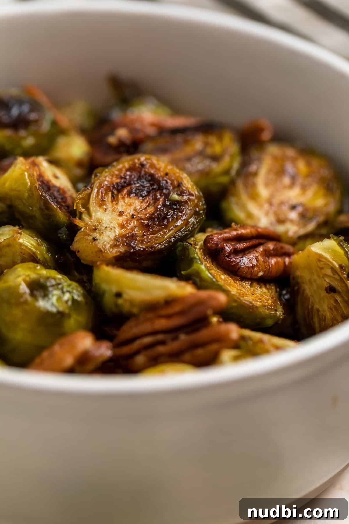 Maple Balsamic Roasted Brussels Sprouts Recipe 6 Dish with roasted brussels sprouts tossed in balsamic.