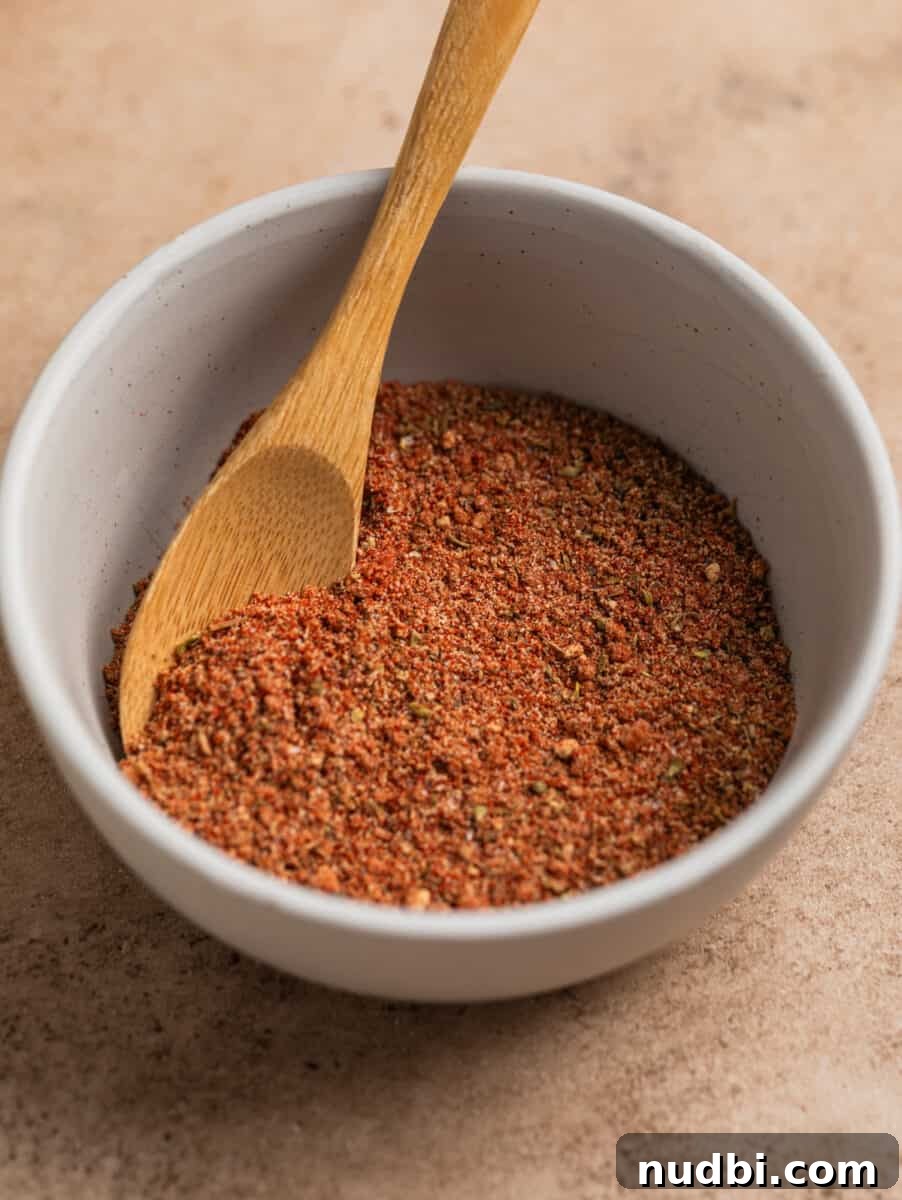 Crispy Air Fryer Country-Style Ribs with Tangy BBQ Glaze 4 Dry rub in bowl with small wooden spoon.