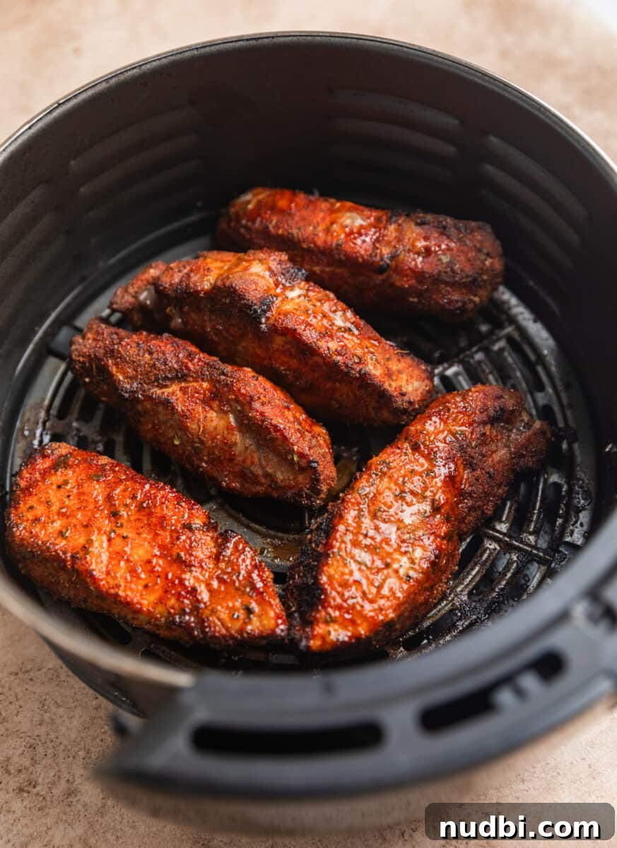 Crispy Air Fryer Country-Style Ribs with Tangy BBQ Glaze 8 Air fried country ribs before BBQ sauce spread on top.