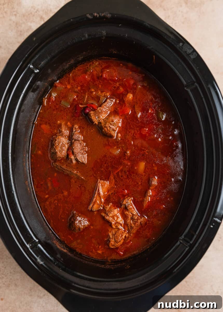 Slow Cooker Shredded Beef Chili Recipe for Comforting Weeknights 6 Cooked slow cooker chili before beef is shredded.