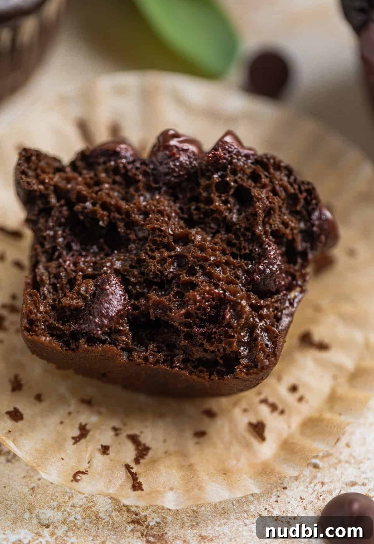 Chocolate green smoothie muffin with bite taken.
