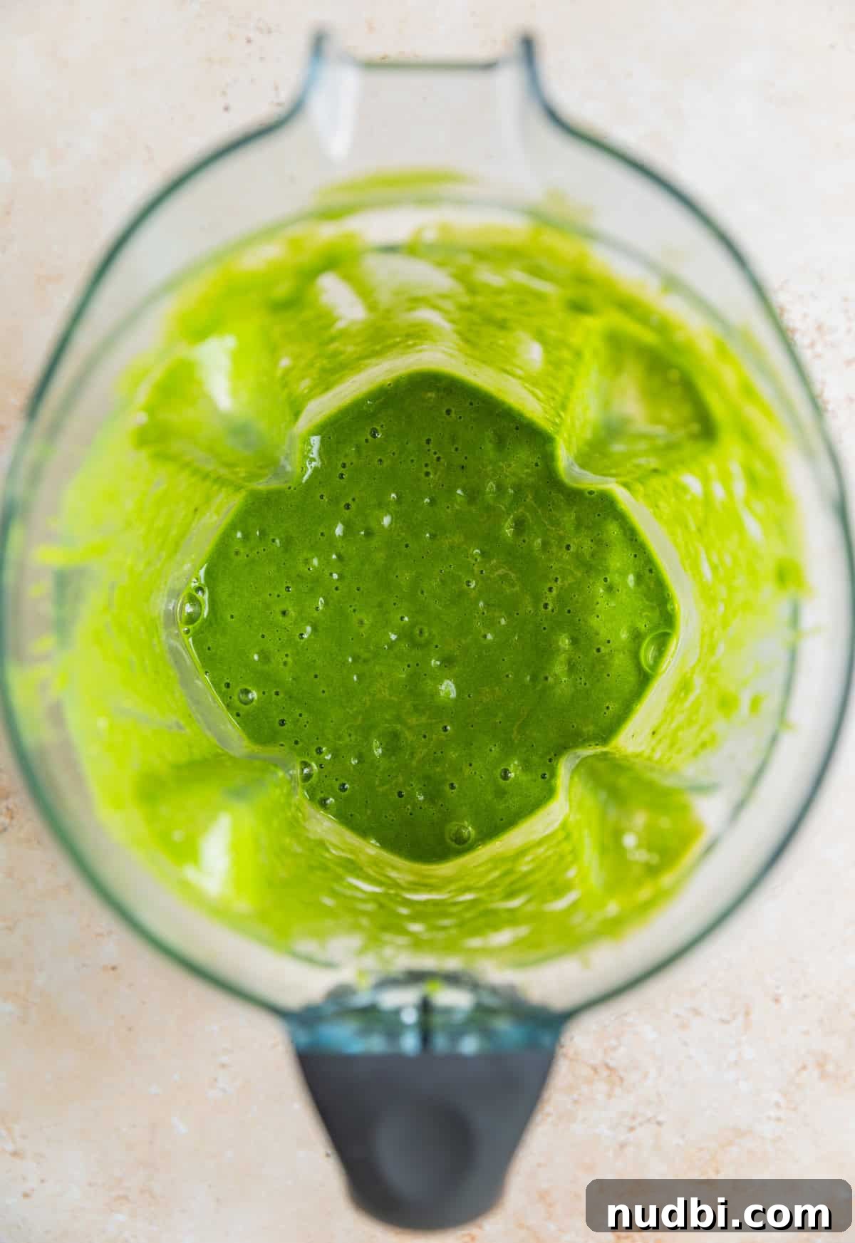 Blended green smoothie ingredients in blender.