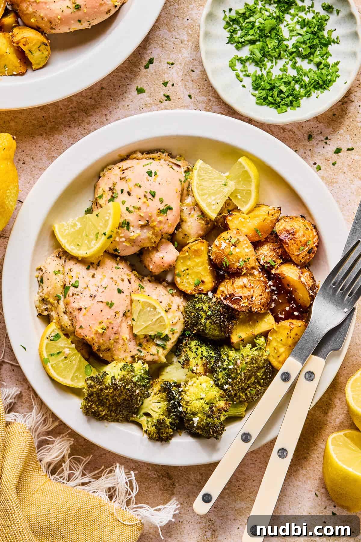 Crispy Lemon Chicken and Roasted Broccoli Sheet Pan Dinner 8 Lemon chicken, potatoes and broccoli on plate.