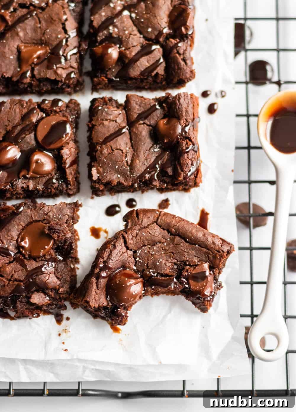 Double Chocolate Brownies Made with White Beans 4 Sliced white bean brownies with chocolate drizzle.